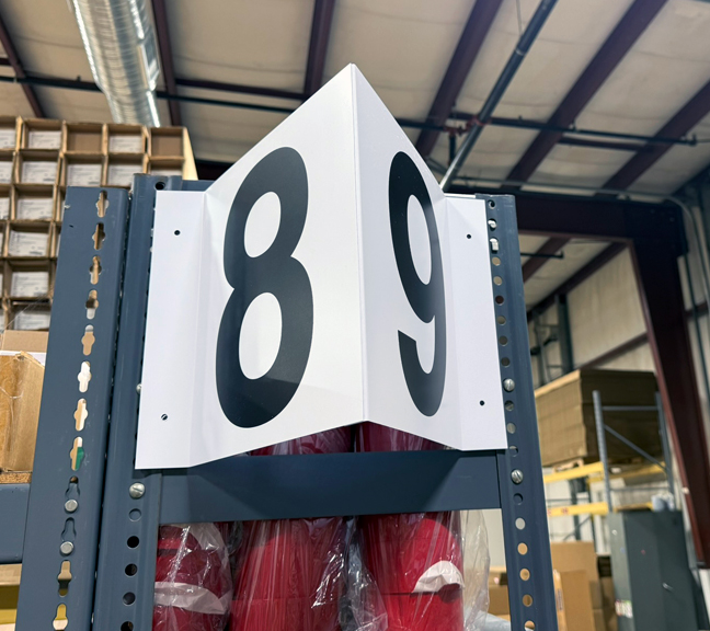 end-of-rack sign spanning flue 