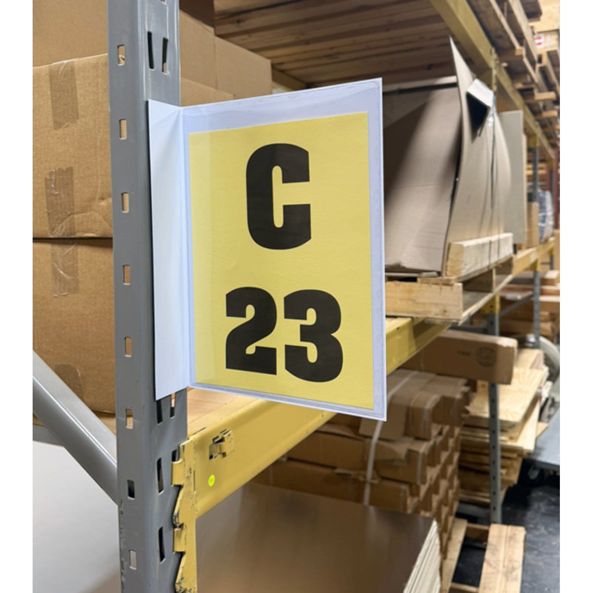 Magnetic warehouse aisle pouch sign on rack upright