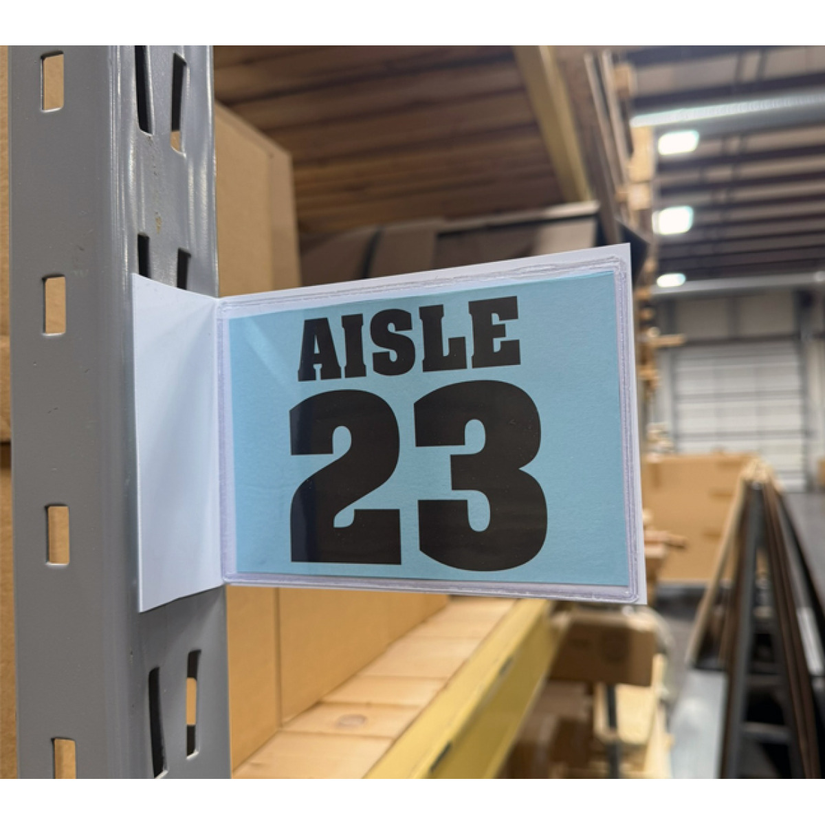 Magnetic warehouse aisle pouch sign on rack upright