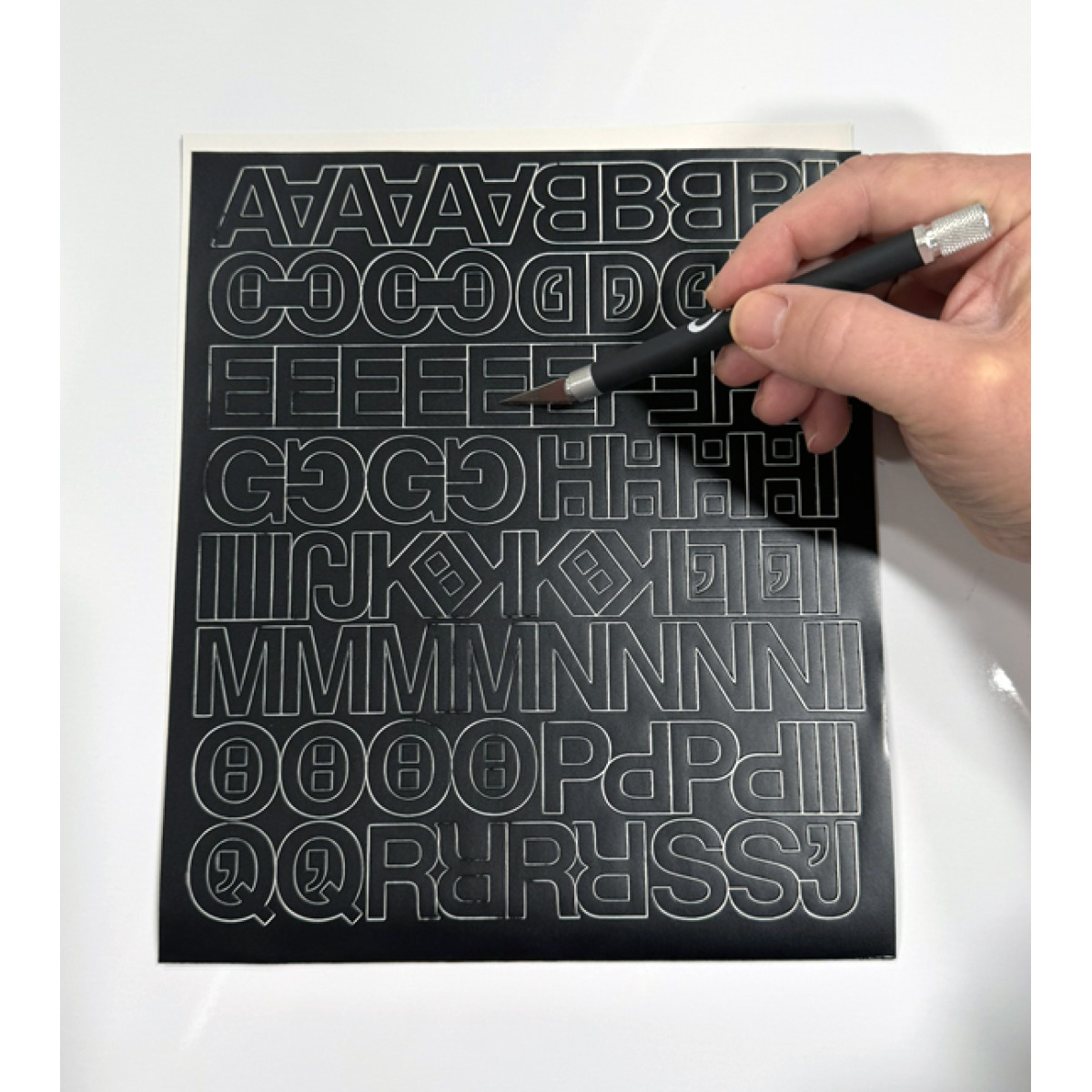 Apply self-adhesive letters and numbers to racks, shelves, bins, totes, doors