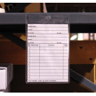 adhesive card holder tag on warehouse shelf lip 
