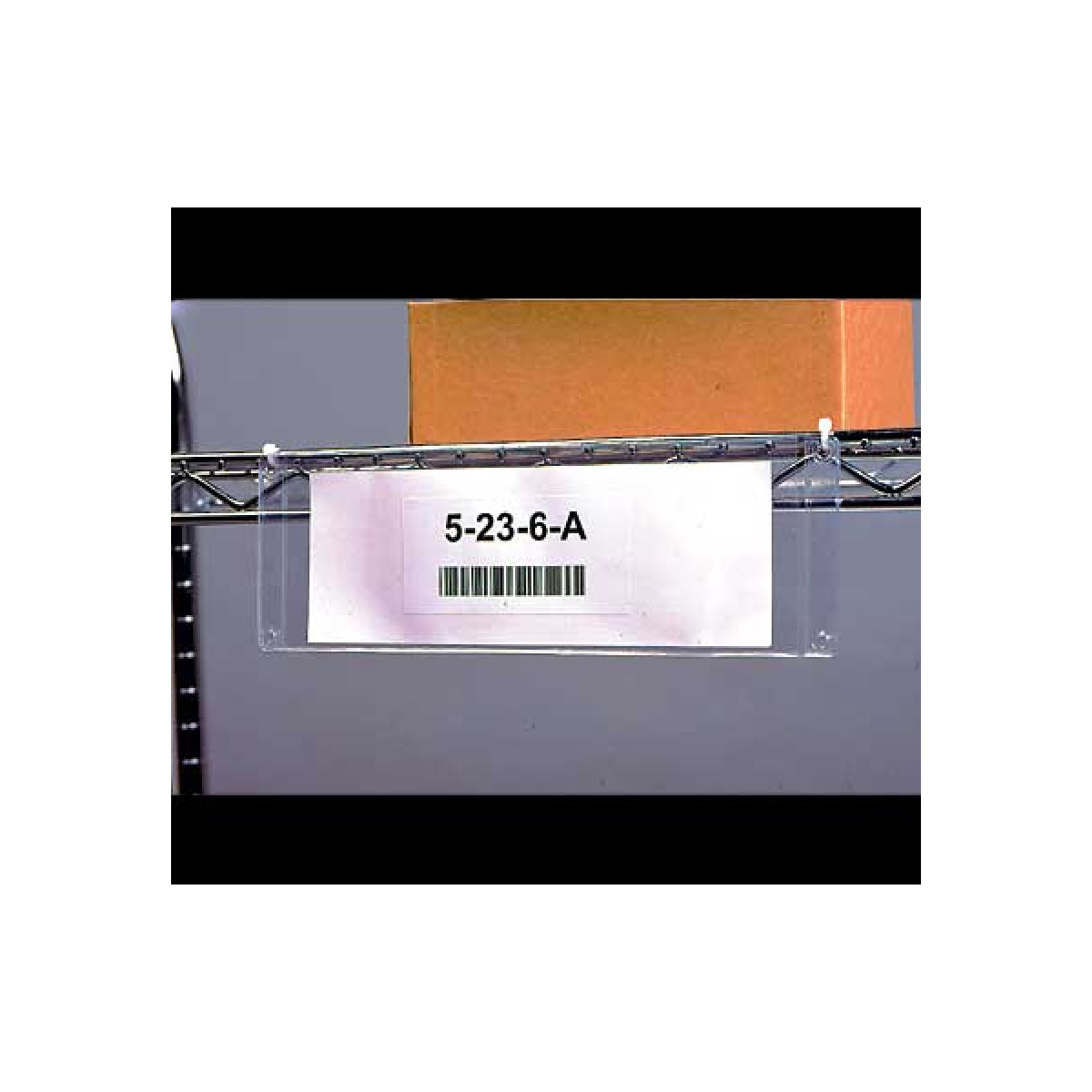 Grommet-style holder on wire rack for warehouse Grommet-style holder on wire rack for warehouse