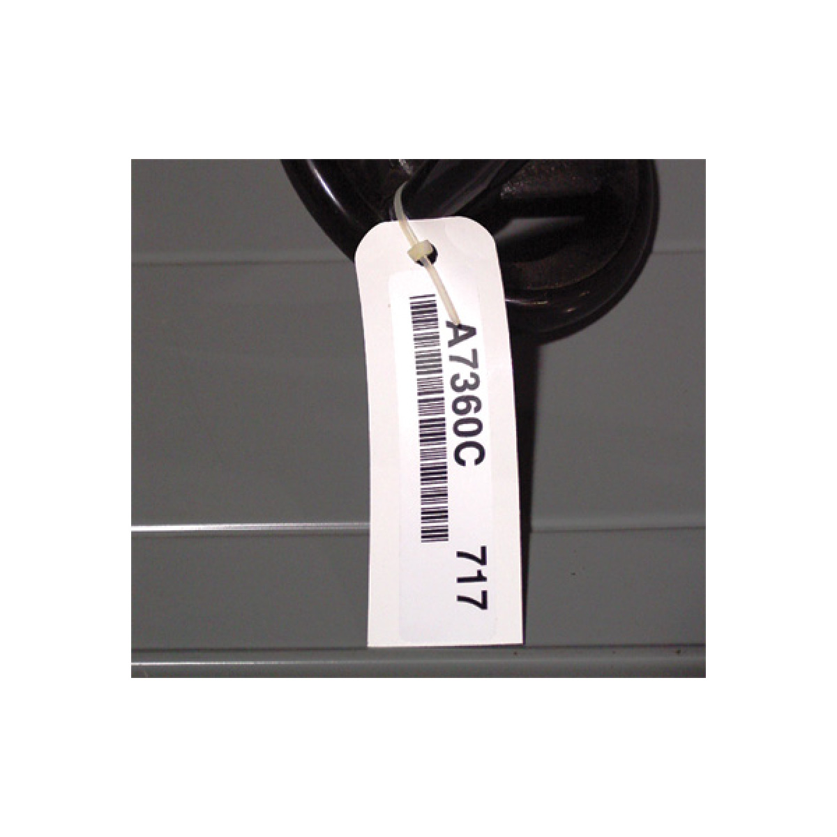 Warehouse label mount tag with a bar code label Warehouse label mount tag with a bar code label